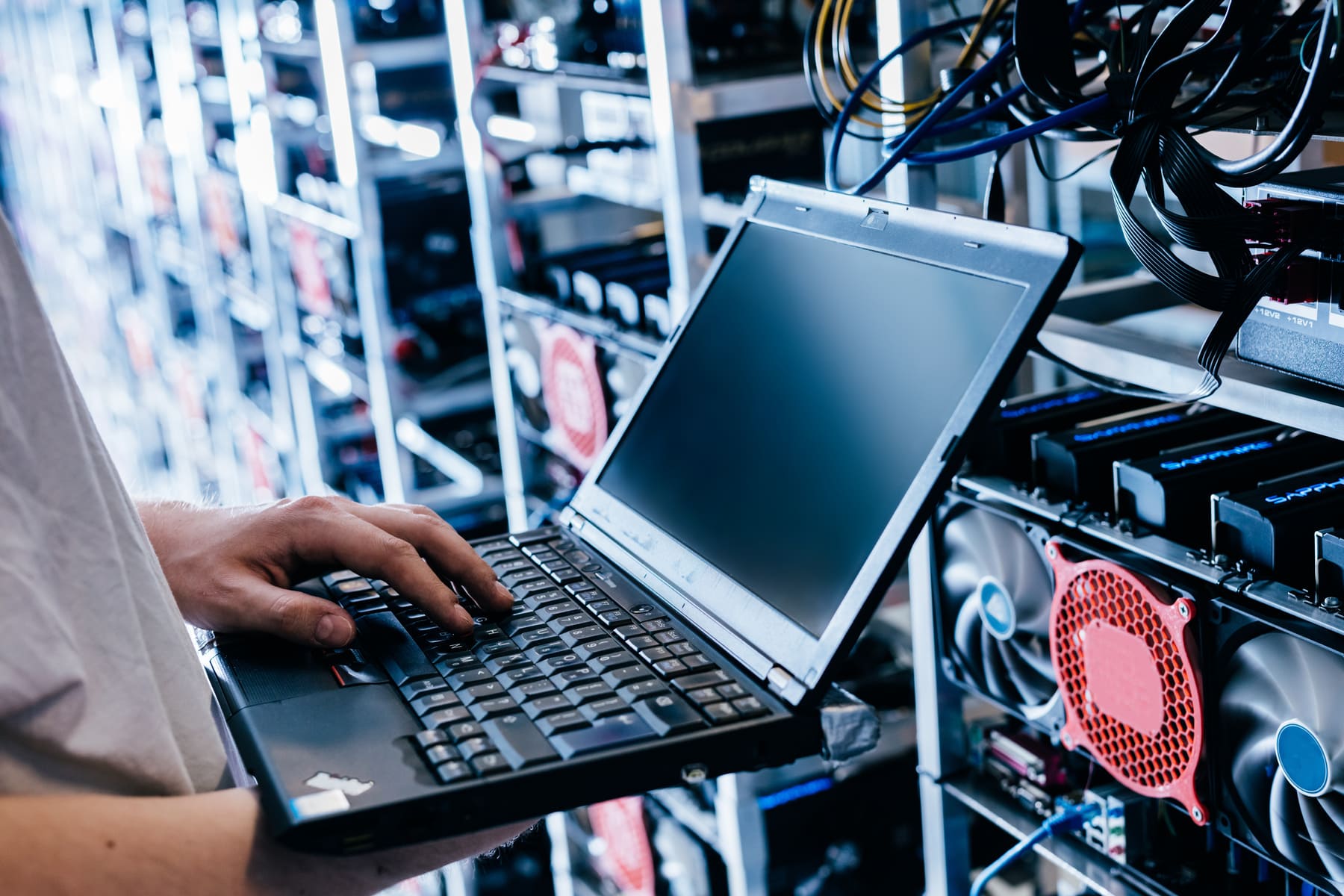 man holding laptop